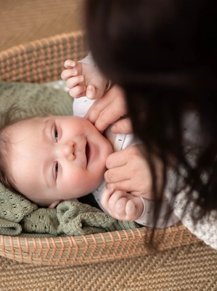 Mum stroking baby's cheeks