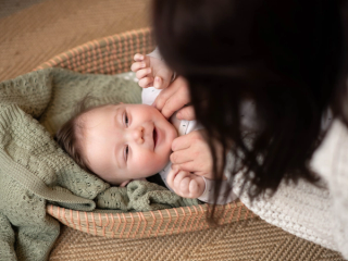 Mum stroking baby's cheeks