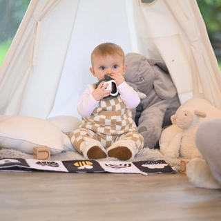 Baby using teething toy