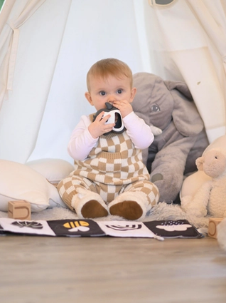 Baby using teething toy