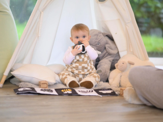 Baby using teething toy