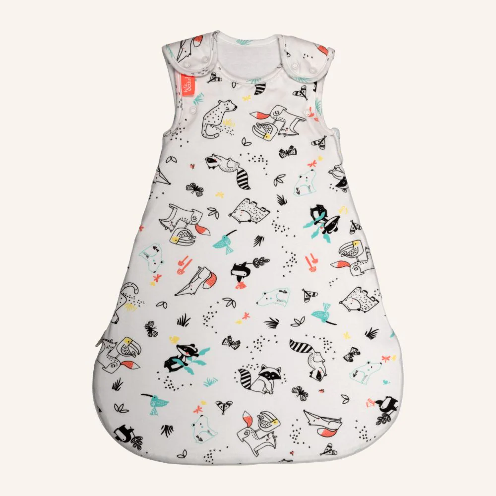 White baby sleeping bag with colourful animal and nature print, shown as part of an exclusive Folk & Thread discount offer