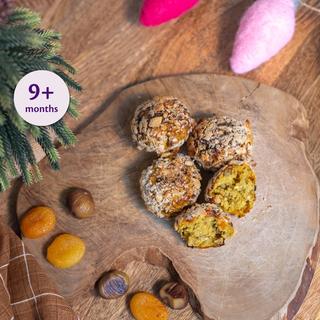 Festive Christmas bite-sized balls on a wooden board, suitable as a soft weaning snack for babies 9 months and over
