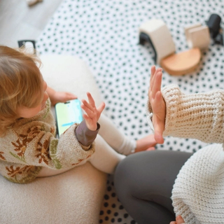 Child playing on phone