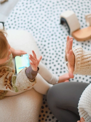 Child playing on phone