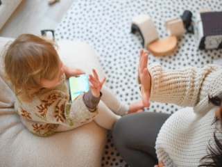 Child playing on phone