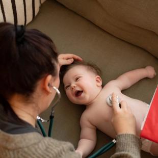 Baby at health visitor appointment