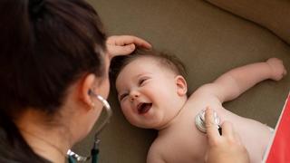 Baby at health visitor appointment
