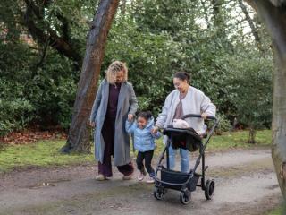 Mum and Grandma walking with toddler and buggy