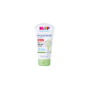 HiPP Babysanft Pflegecreme Sensitiv 75 ml Tube mit grünem Verschluss auf schwarzem Hintergrund, für zarte Babyhaut