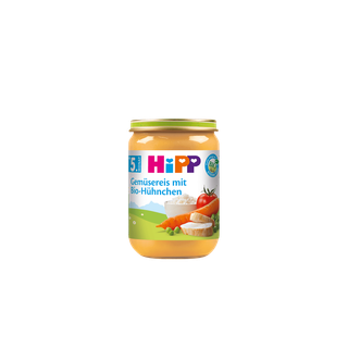 HiPP Bio-Gläschen „Gemüsereis mit Bio-Hühnchen“ ab dem 5. Monat vor schwarzem Hintergrund, Glas frontal zentriert