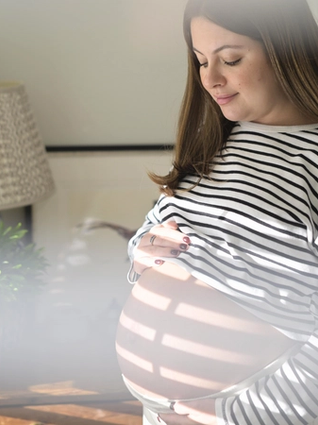 Woman staring adoringly at bump