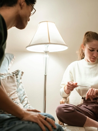 A couple nervously waiting for pregnancy test results