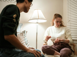 A couple nervously waiting for pregnancy test results