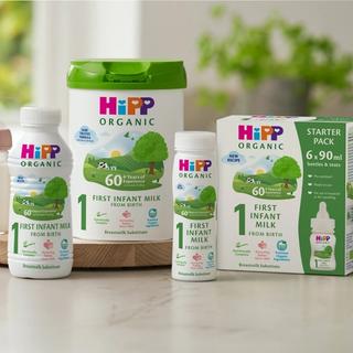 HiPP Organic first infant milk ready to feed starter pack with 6 x 90ml bottles and teats arranged on a kitchen worktop