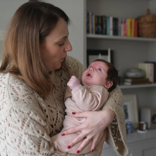 Mom soothing crying baby