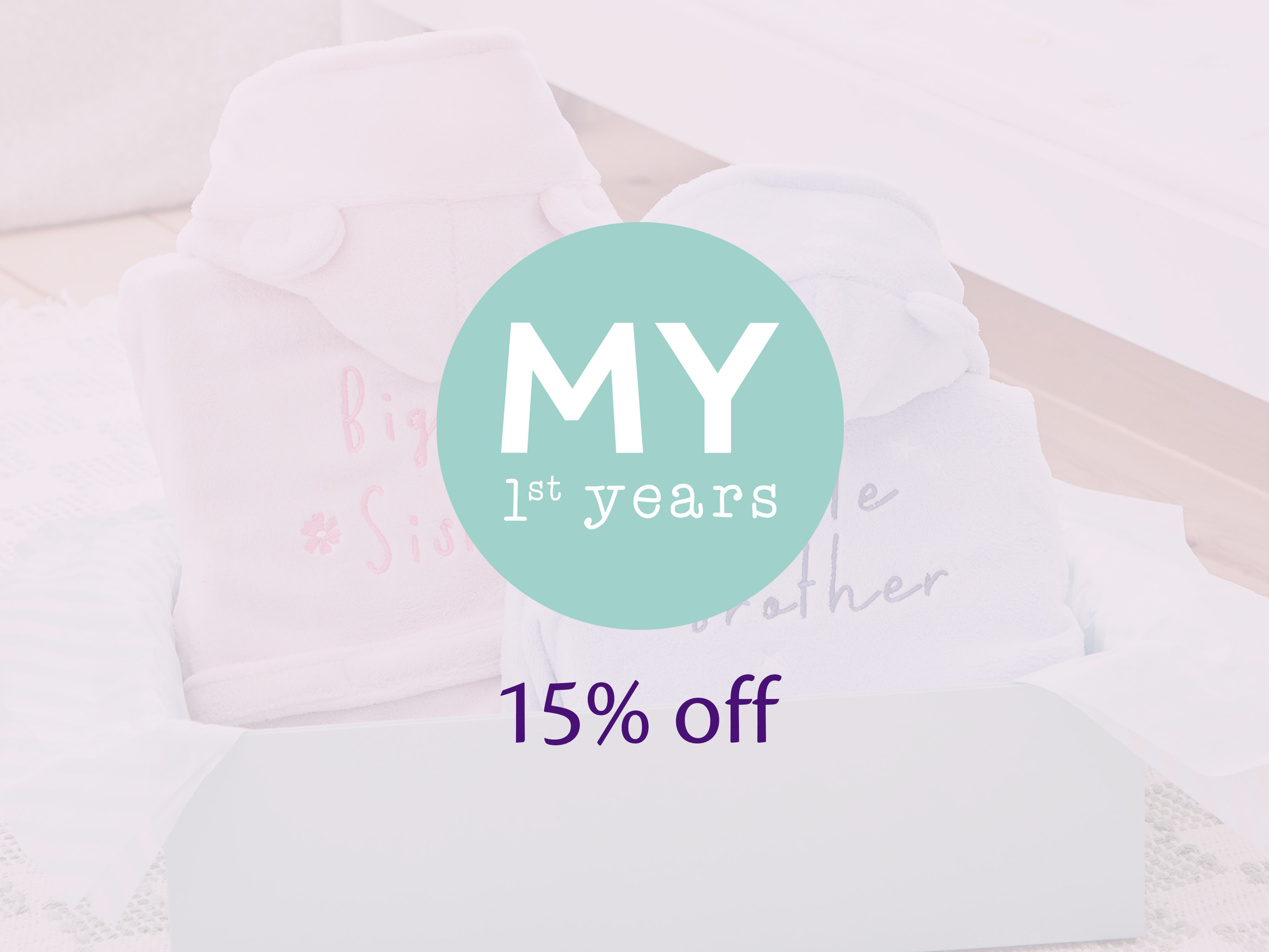 My 1st Years logo over soft pastel baby robes with text reading 15% off, promoting personalised baby gifts