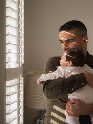 Dad holding newborn