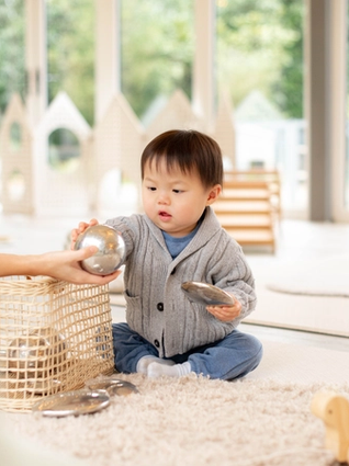 Toddler playing with toys