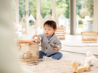 Toddler playing with toys