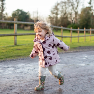 Toddler running down path