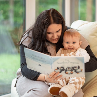 Mum reading with baby