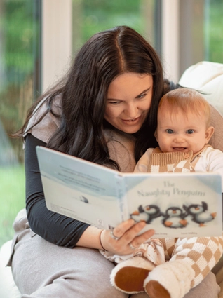 Mum reading with baby