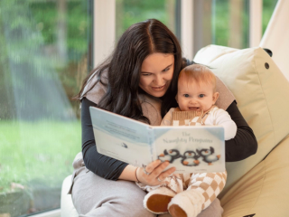 Mum reading with baby