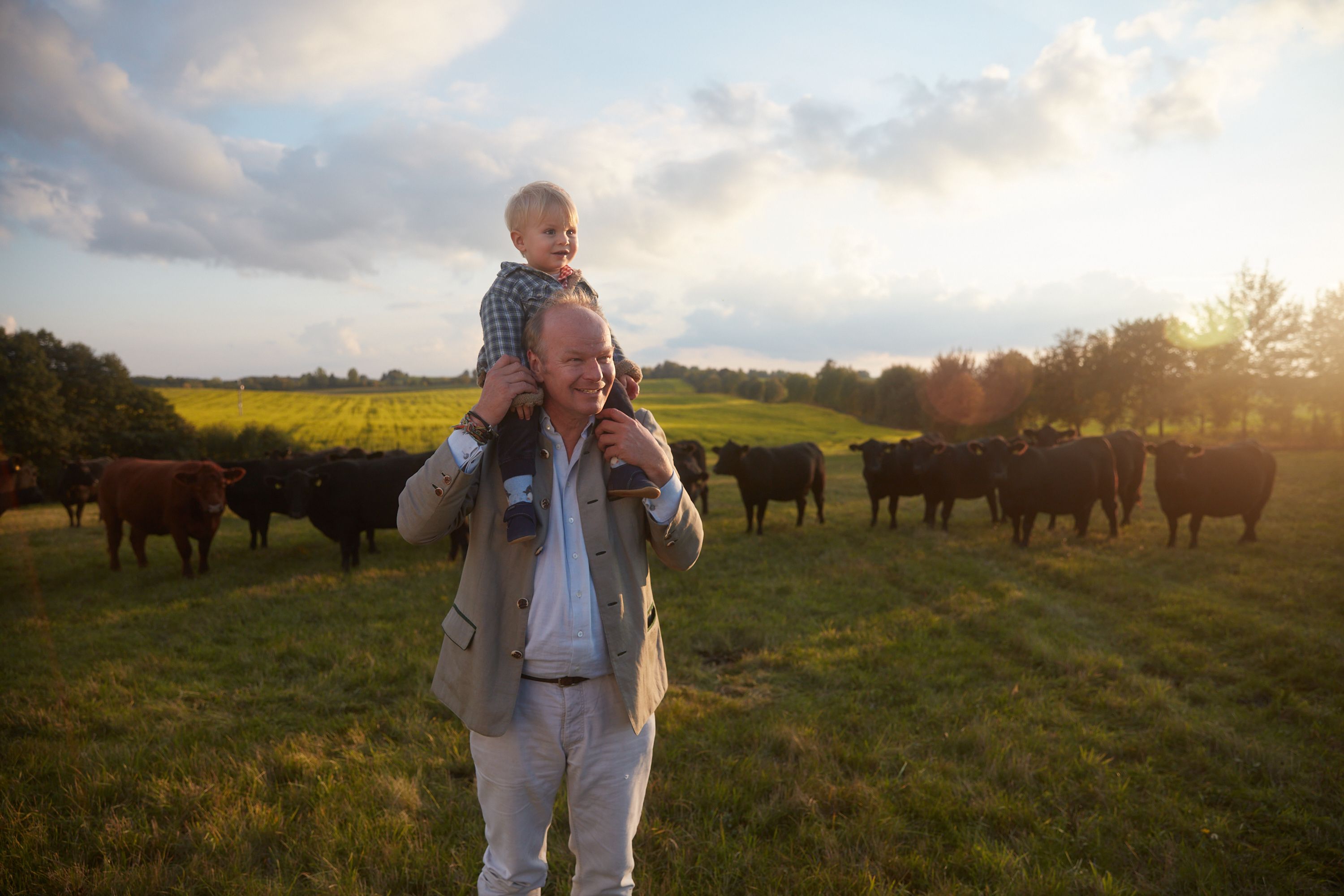 Stefan and son walking in a field