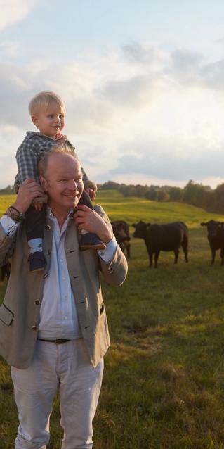 Stefan and son walking in a field