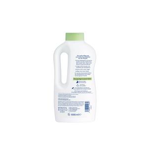 Rückseite einer weißen Kunststoffflasche mit grünem Verschluss und Text in mehreren Absätzen