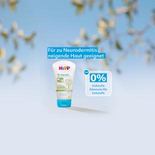 Tube mit Hautpflegeprodukt vor unscharfem Hintergrund mit Text 'Für zu Neurodermitis neigende Haut geeignet' und '0% Duftstoffe, Ätherische Öle, Farbstoffe'