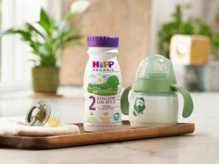 HiPP Organic Follow On Milk next to a baby bottle
