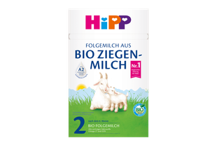 Packung HiPP 2 Folgemilch aus BIO Ziegenmilch mit zwei Ziegen auf grüner Wiese und Bio-Siegel auf weiß-grünem Hintergrund.