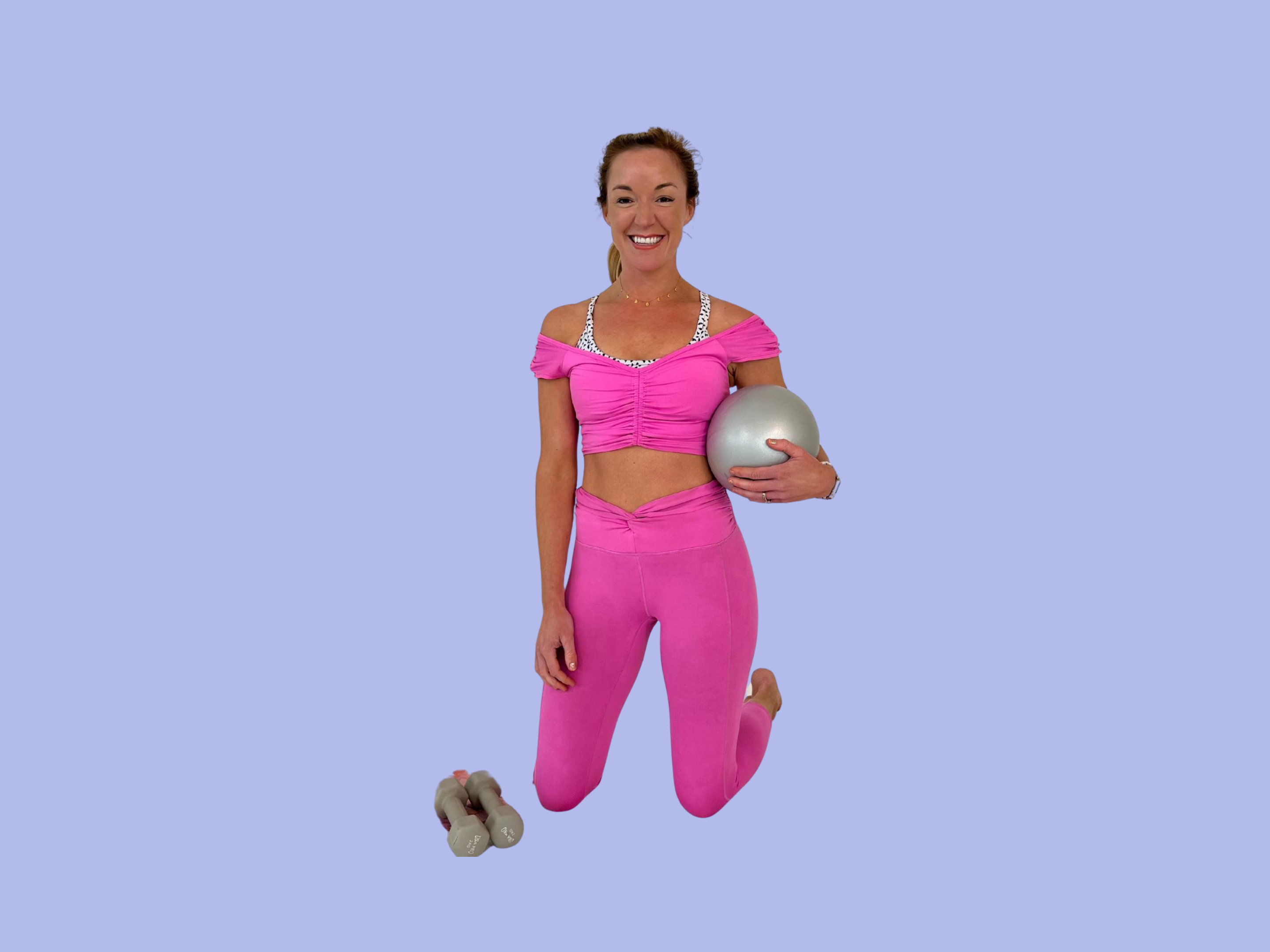 Woman with pilates ball and light weights