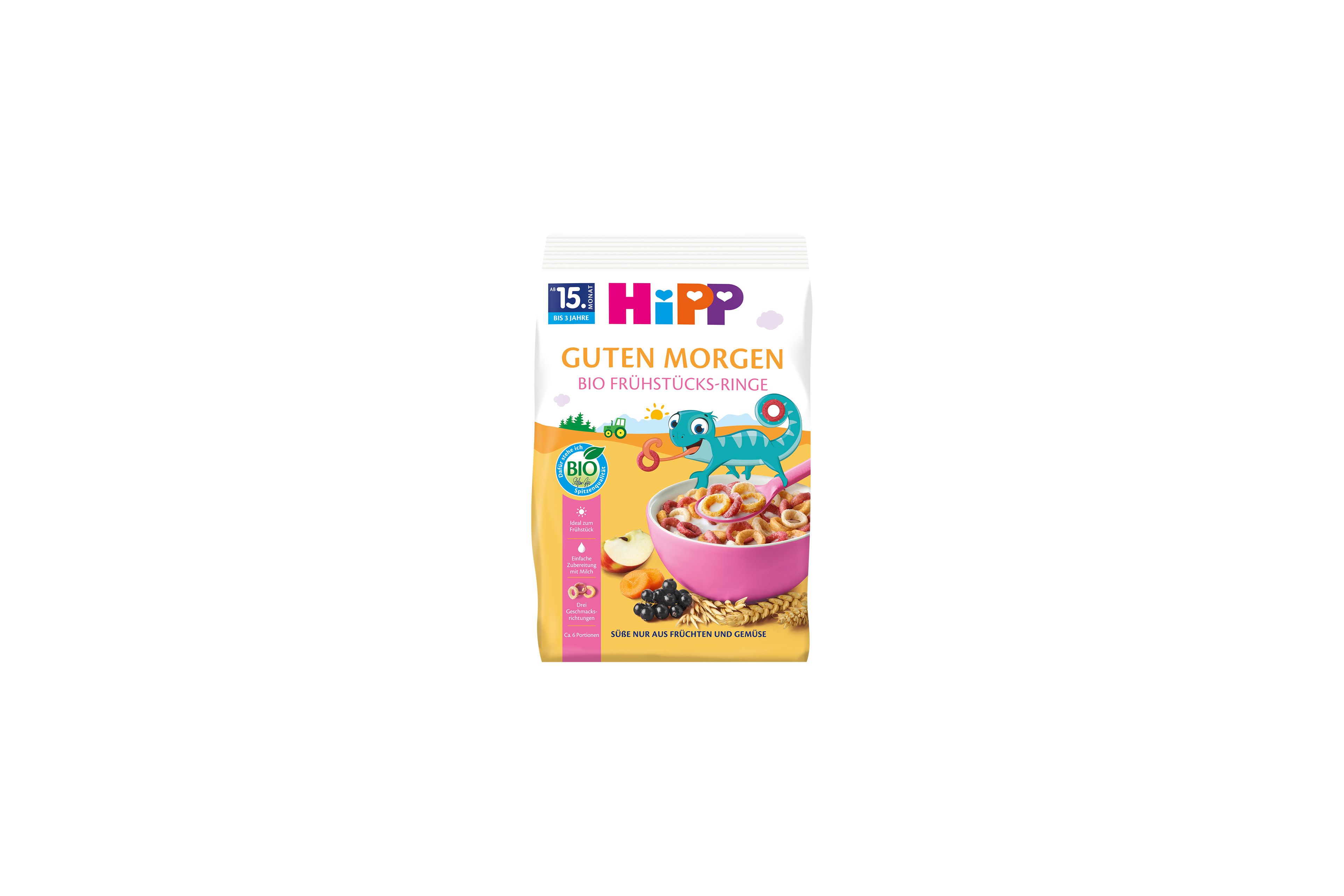 HiPP Guten Morgen Bio Frühstücks-Ringe Packung mit bunter Müslischale, Getreide und Früchten auf gelbem Hintergrund