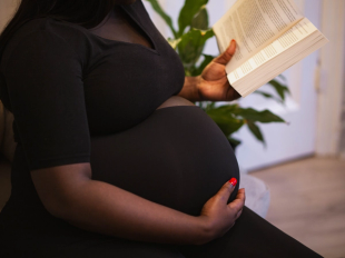 Pregnant woman reading book