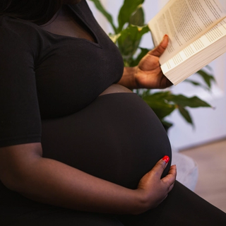 Pregnant woman reading book