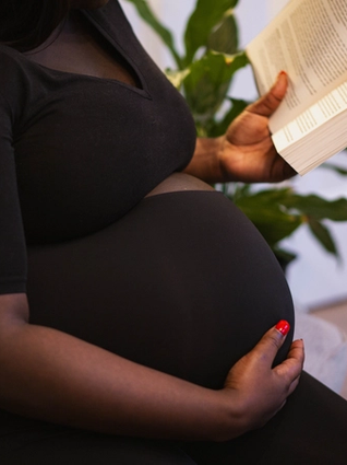 Pregnant woman reading book