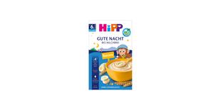 HiPP Gute Nacht Bio Milchbrei Banane Packung mit Schüssel Brei, Bananenscheiben und Getreideähren auf blauem Hintergrund