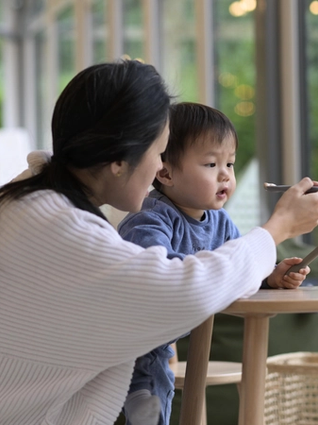Mum feeding her toddler