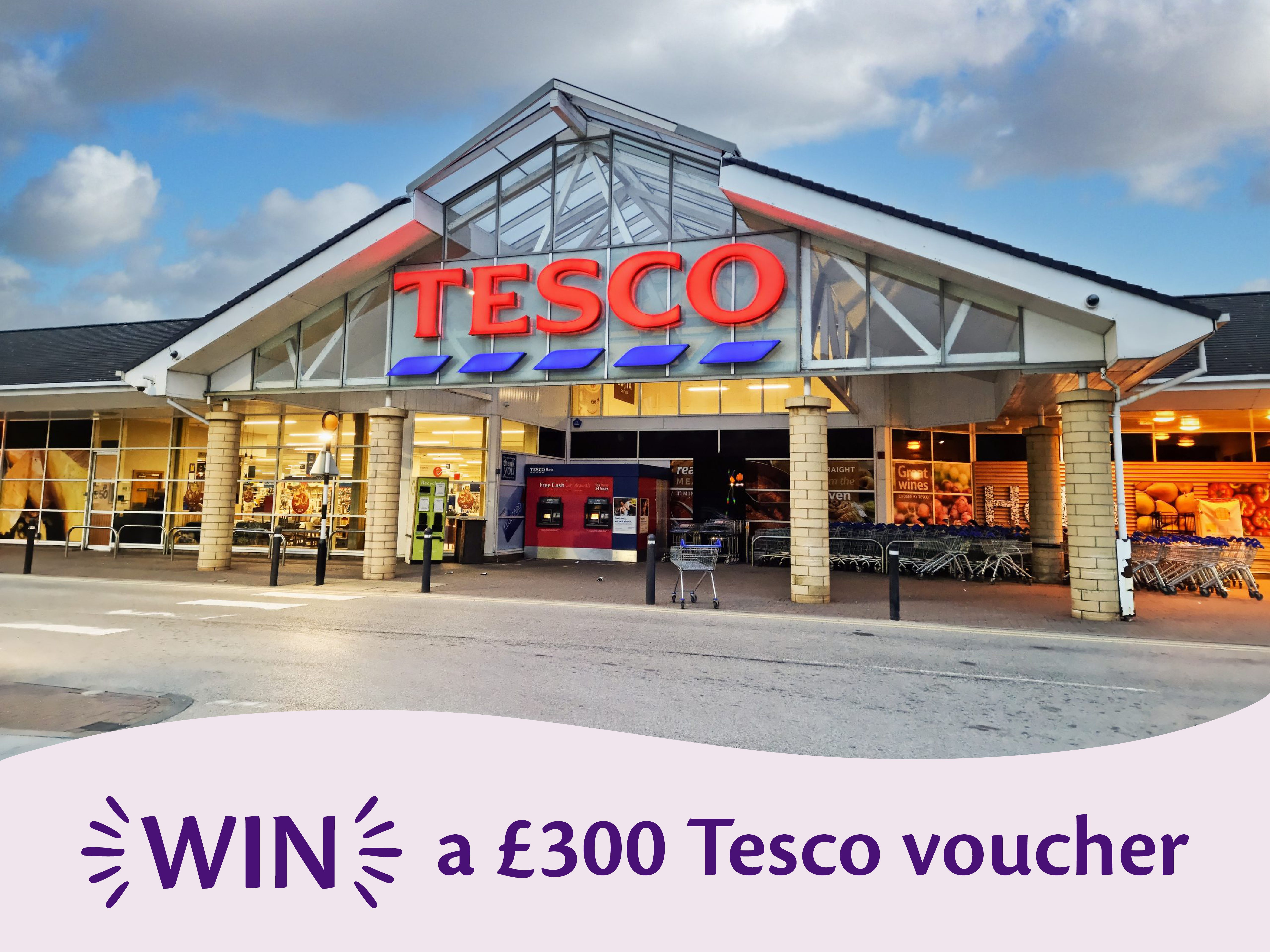 Promotional banner showing the storefront of a Tesco supermarket with a text overlay that reads: "WIN a £300 Tesco voucher".