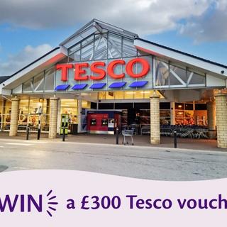 Promotional banner showing the storefront of a Tesco supermarket with a text overlay that reads: "WIN a £300 Tesco voucher".
