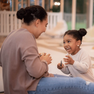 Mum and daughter playing