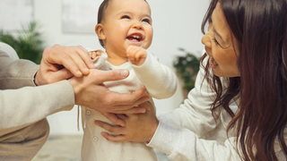 Mum and baby laughing togetther