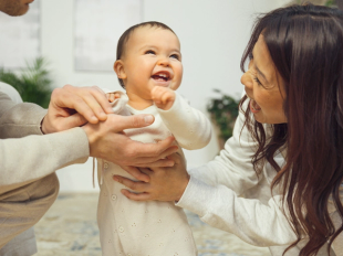 Mum and baby laughing togetther
