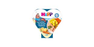 HiPP Bio Babymahlzeit „Kartoffeln mit feinem Wildlachs und Karotten“ in Herzchen-Schale mit Serviervorschlag auf der Verpackung