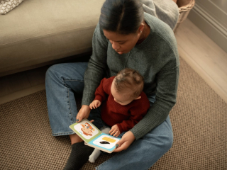 Mum reading to baby