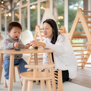 Mum and son playing at toddler table