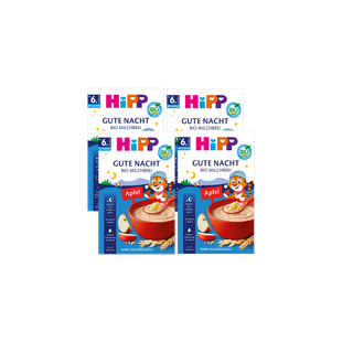 Viererpack HiPP Gute Nacht Bio Milchbrei Apfel, ab 6 Monaten, ohne Zuckerzusatz auf schwarzem Hintergrund angeordnet